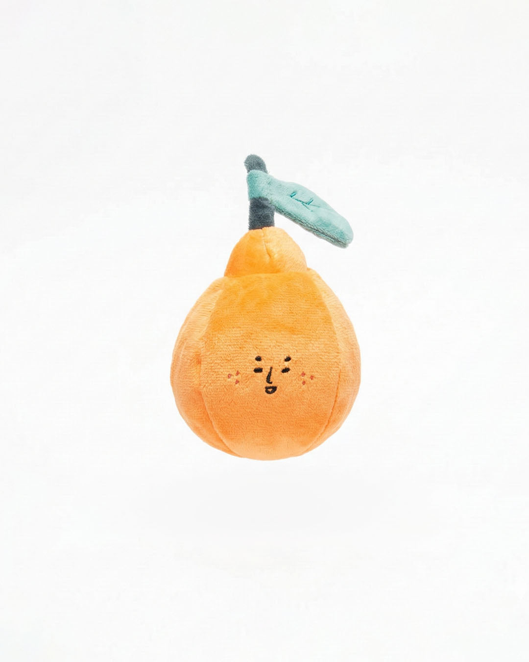 Orange nosework plush dog toy on white background