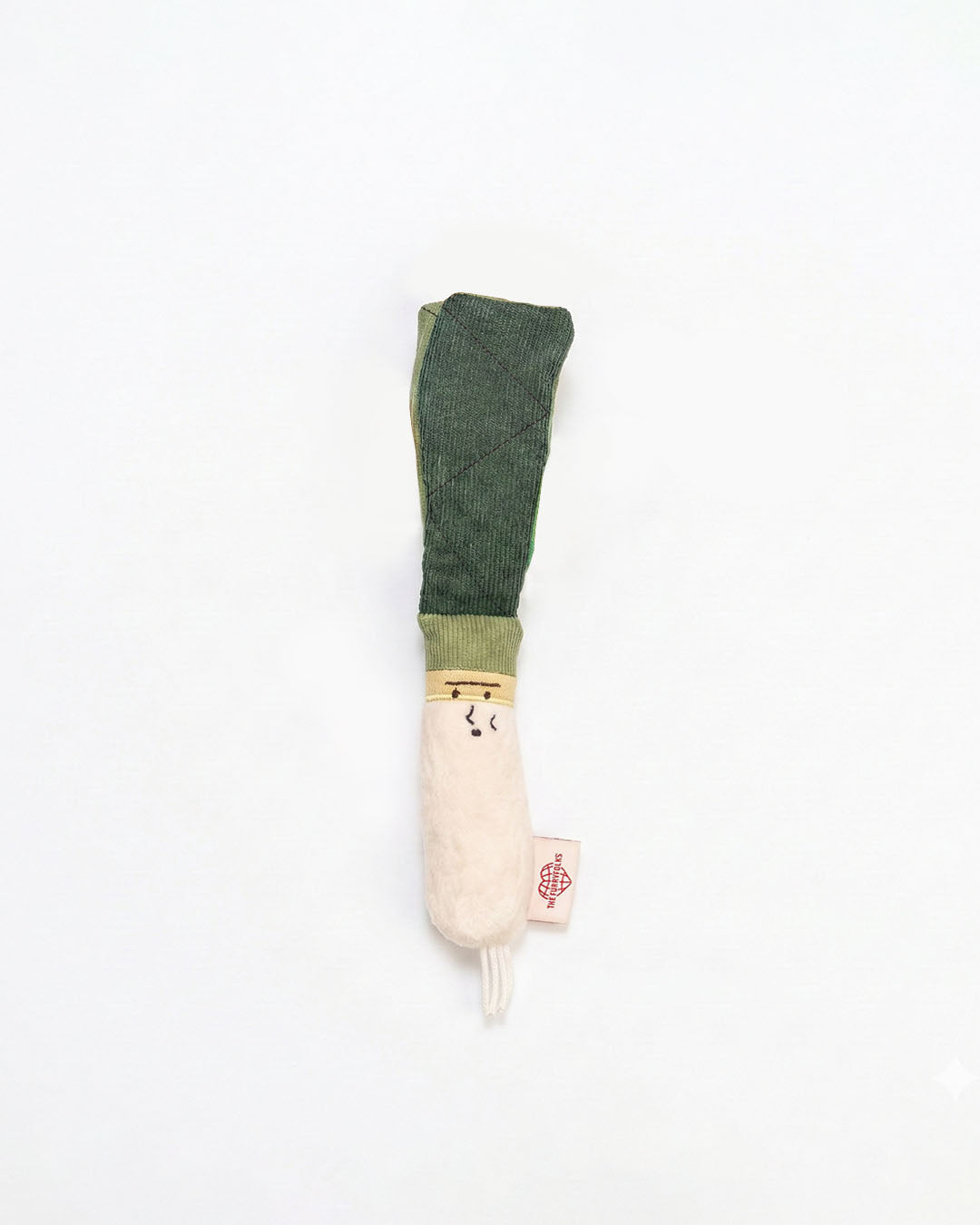 Green onion nosework plush dog toy on white background