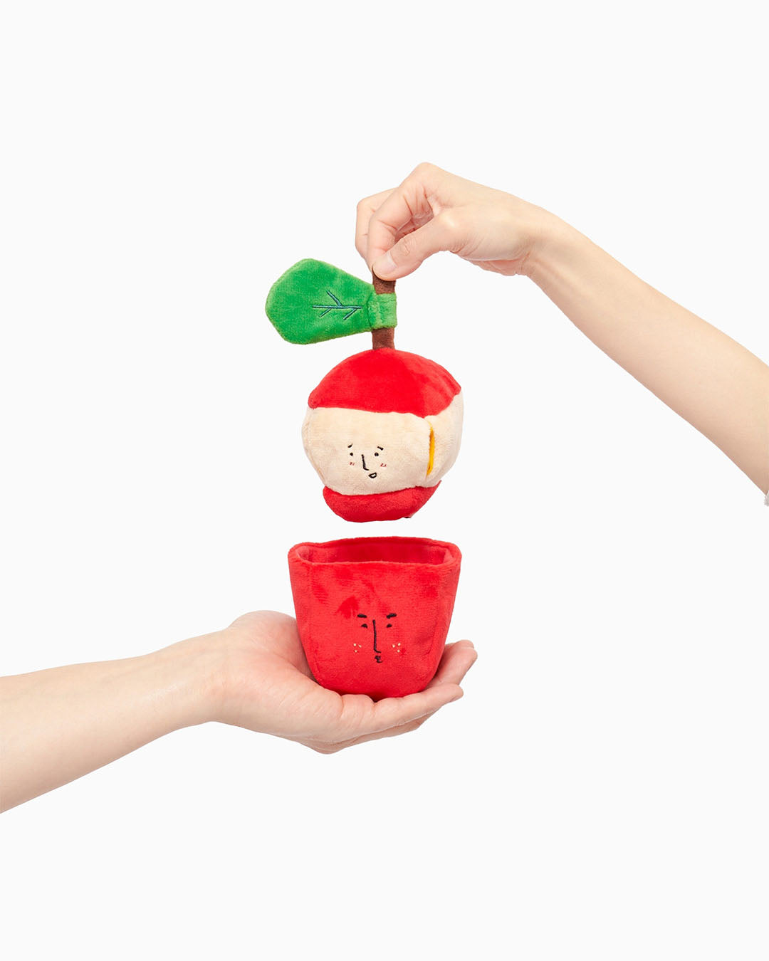 Two-piece apple nosework plush dog toy with inner apple and peel pocket on white background