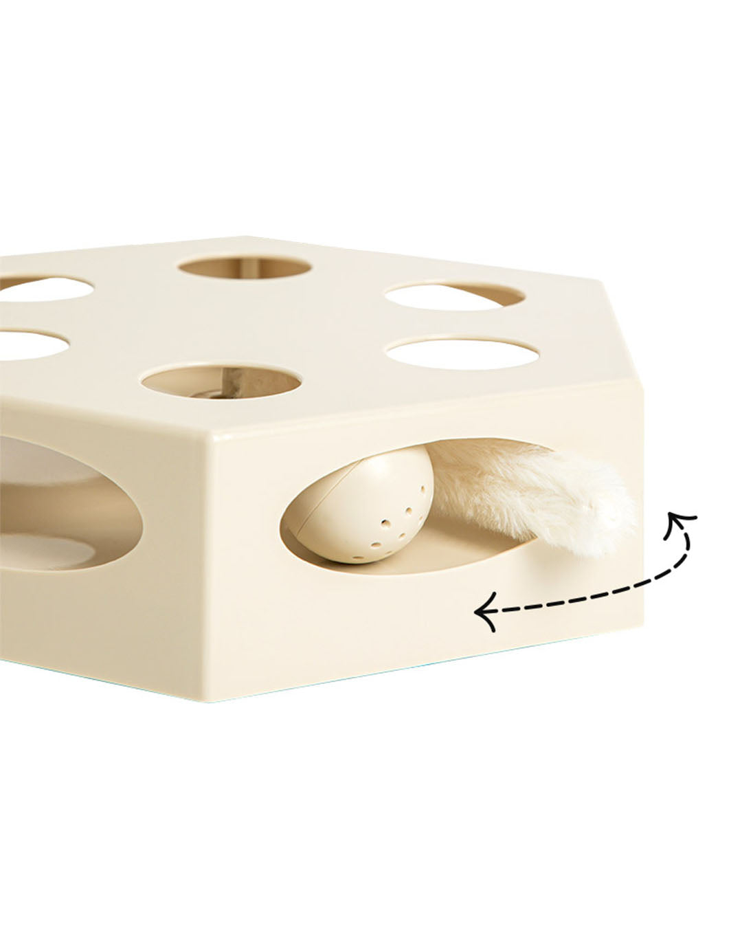 A moving cat toy with a feather wand shifting left and right through the holes.