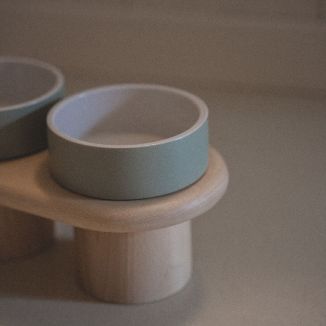 Close-up of the Dumbo Table's non-toxic ceramic bowls, emphasizing their hygienic and durable quality.